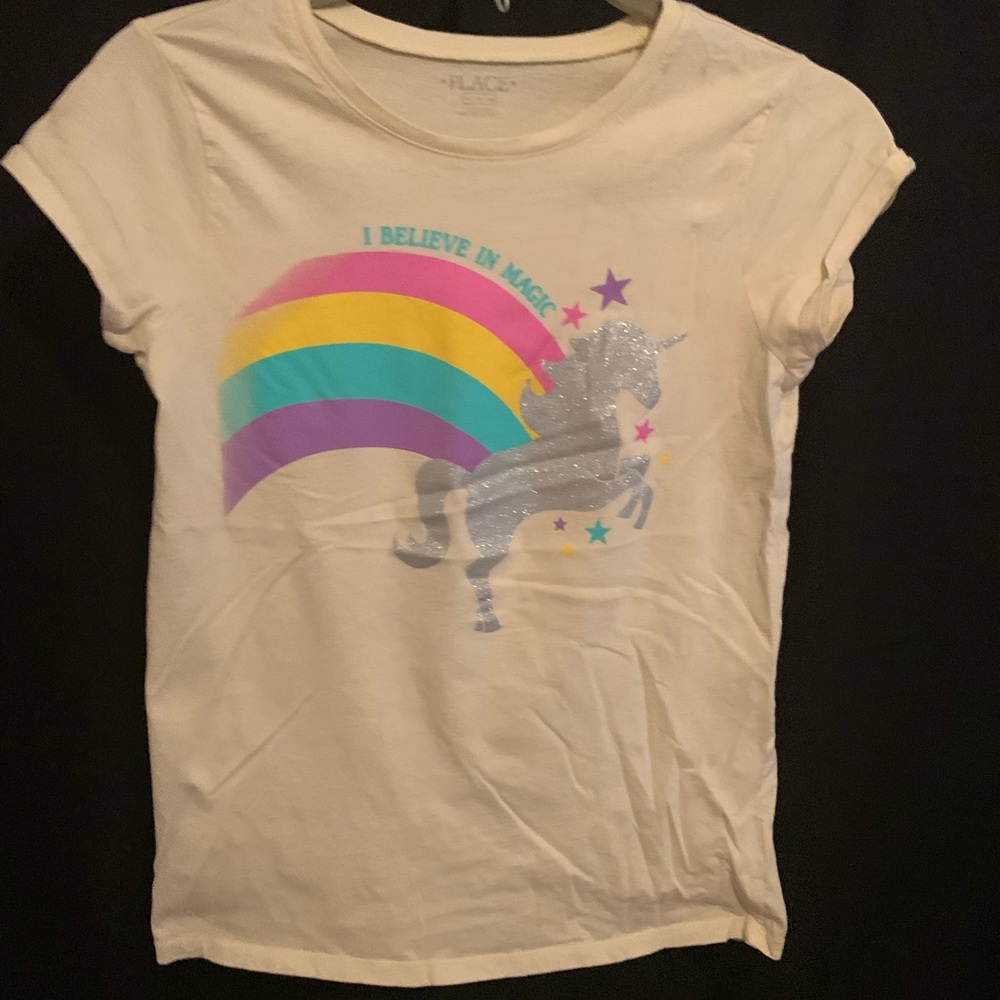 Cream colored kids tee with unicorn/rainbow